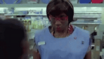 Woman In Blue Apron And Red Glasses Talking To Man GIF