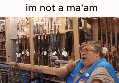 Woman In Blue Apron In Front Of Guns Saying Im Not A Ma GIF