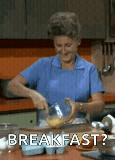 Woman In Blue Apron Preparing Food GIF