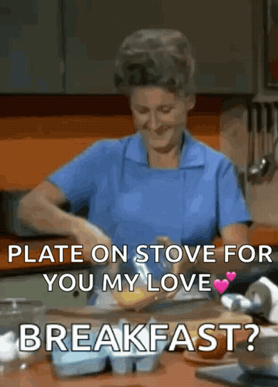 Woman In Blue Apron Preparing Food Says Plate On Stove For You My Love Breakfast GIF