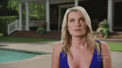 Woman In Blue Bikini Standing In Front Of House GIF