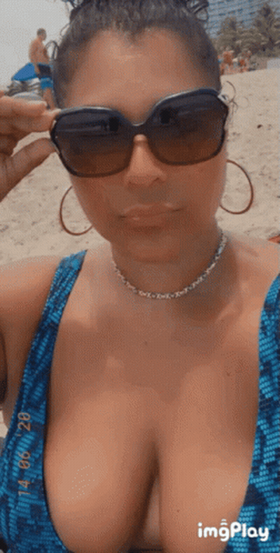 Woman In Blue Bikini Taking Beach Selfie GIF
