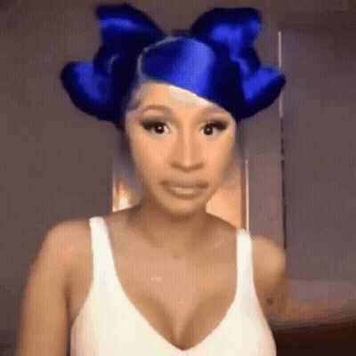 Woman In Blue Bow And White Tank Top GIF