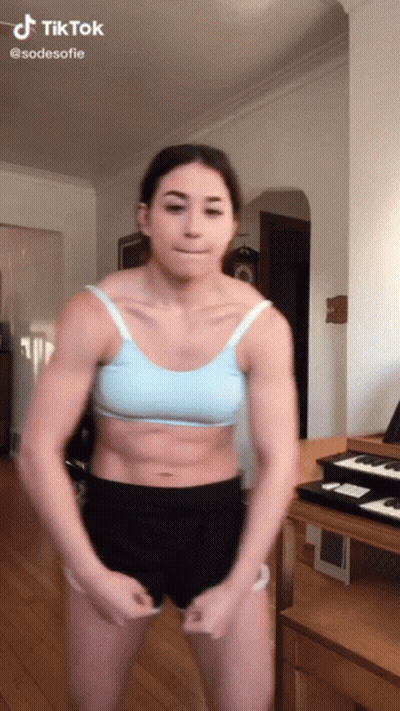 Woman In Blue Bra And Black Shorts By Piano GIF