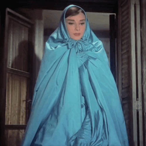 Woman In Blue Cape With Hood GIF