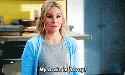 Woman in Blue Cardigan Saying Brain Is Horny
