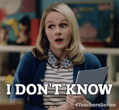 Woman In Blue Cardigan Saying I Don't Know GIF