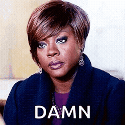Woman In Blue Coat Making Funny Face Saying Damn GIF