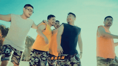 Woman In Blue Crop Top And Black Shorts Smiling And Waving GIF