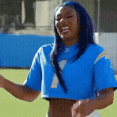 Woman In Blue Crop Top And Football Jersey GIF