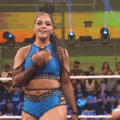 Woman In Blue Crop Top And Shorts In Wrestling Ring GIF