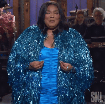 Woman In Blue Dress And Blue Tinsel Coat GIF