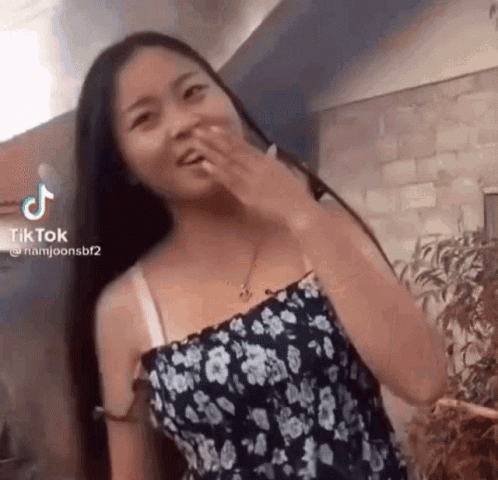 Woman In Blue Dress And Flip Flops Sitting In Chair GIF