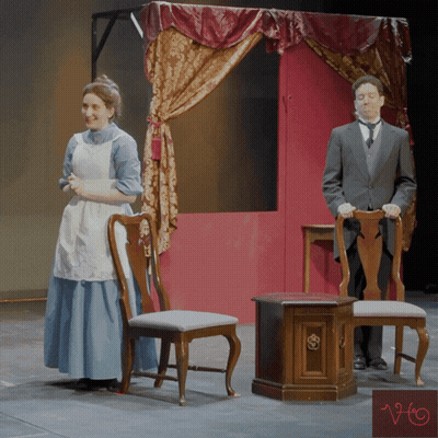 Woman In Blue Dress And Man In Suit Under Canopy GIF