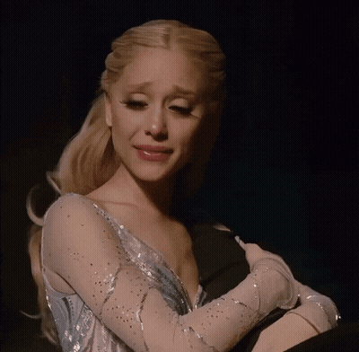 Woman In Blue Dress Crying And Hugging Man GIF