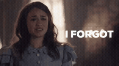 Woman In Blue Dress Crying By I Forgot Sign GIF