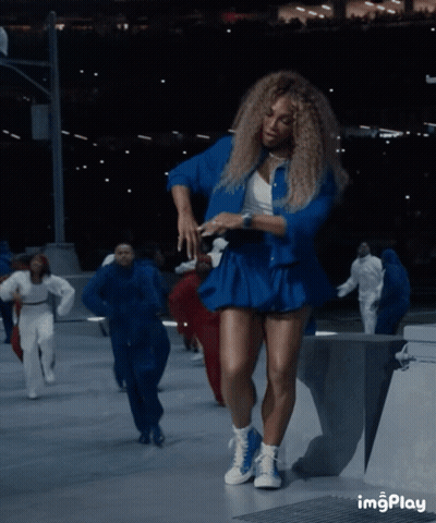 Woman in Blue Dress Dancing