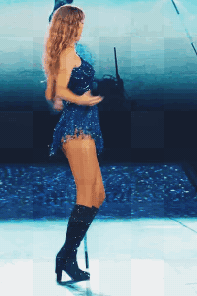 Woman In Blue Dress Dancing On Stage GIF