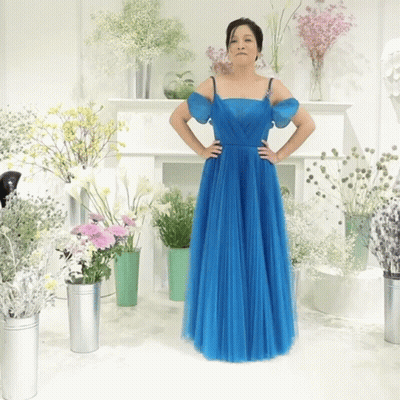 Woman In Blue Dress Hands On Hips Vases GIF