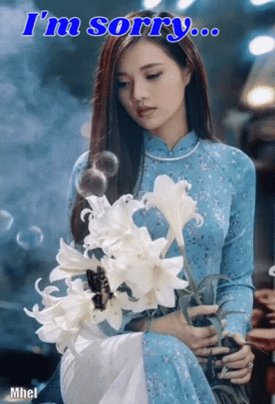 Woman In Blue Dress Holding Flowers Saying I'm Sorry GIF