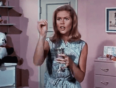 Woman In Blue Dress Holding Glass GIF