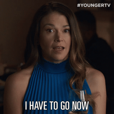 Woman In Blue Dress Holding Glass Saying I Have To Go Now GIF