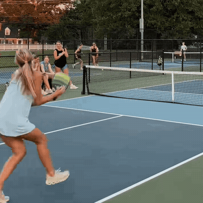 Woman In Blue Dress Holding Tennis Racquet GIF