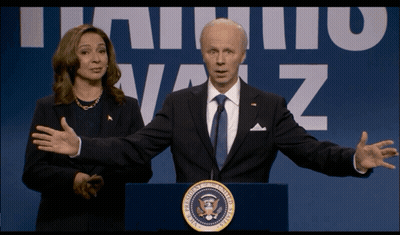 Woman In Blue Dress In Front Of NBC Logo GIF