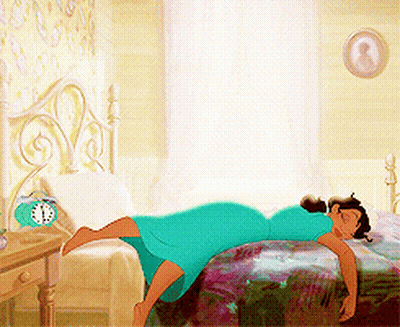Woman In Blue Dress Laying On Bed With Alarm Clock GIF