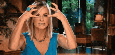 Woman In Blue Dress Making Funny Face GIF