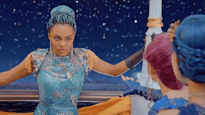 Woman In Blue Dress Next To Two Others GIF