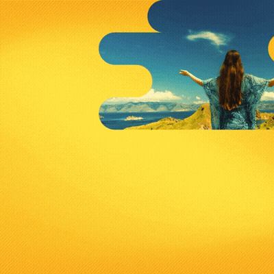 Woman In Blue Dress Overlooking Ocean Arms Outstretched GIF