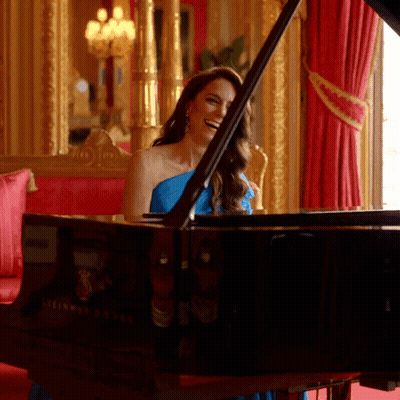 Woman In Blue Dress Playing Steinway Grand Piano GIF