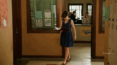 Woman In Blue Dress Reading Book In Hallway GIF