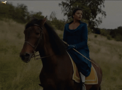 Woman In Blue Dress Riding Horse GIF