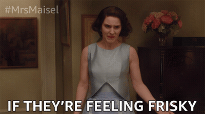 Woman In Blue Dress Saying Feeling Frisky GIF