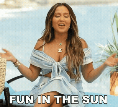 Woman In Blue Dress Saying Fun In The Sun By Pool GIF
