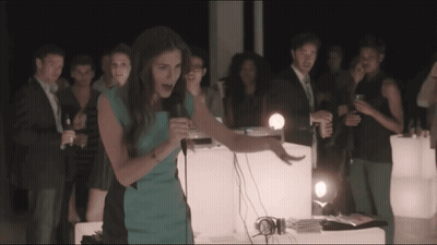 Woman In Blue Dress Singing Into Microphone GIF