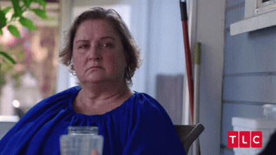 Woman In Blue Dress Sits In Chair TLC GIF