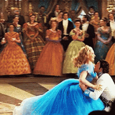 Woman In Blue Dress Sitting On Man's Lap GIF