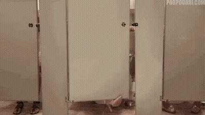 Woman In Blue Dress Sitting On Toilet In Public Restroom GIF