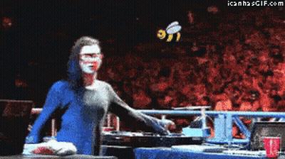 Woman In Blue Dress Standing Before Crowd With Bee GIF