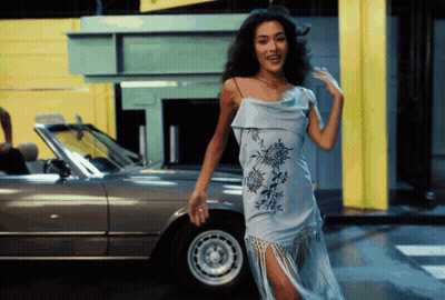 Woman In Blue Dress Standing By Silver Car GIF