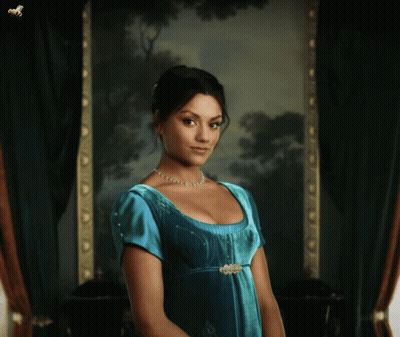 Woman In Blue Dress Standing In Front Of Picture GIF