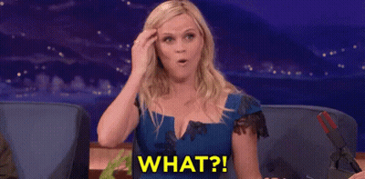 Woman In Blue Dress Surprised Holding Head GIF