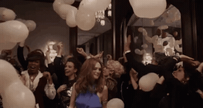 Woman In Blue Dress Surrounded By Balloons GIF