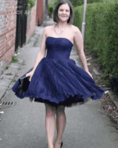 Woman In Blue Dress Walking Down Street GIF