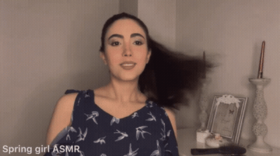 Woman In Blue Dress With Birds And Ponytail GIF