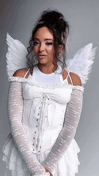 Woman In Blue Dress With White Wings Flying Through Clouds GIF