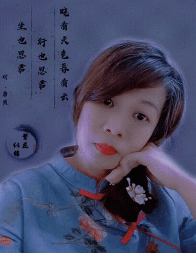 Woman In Blue Floral Shirt Looking At Camera GIF